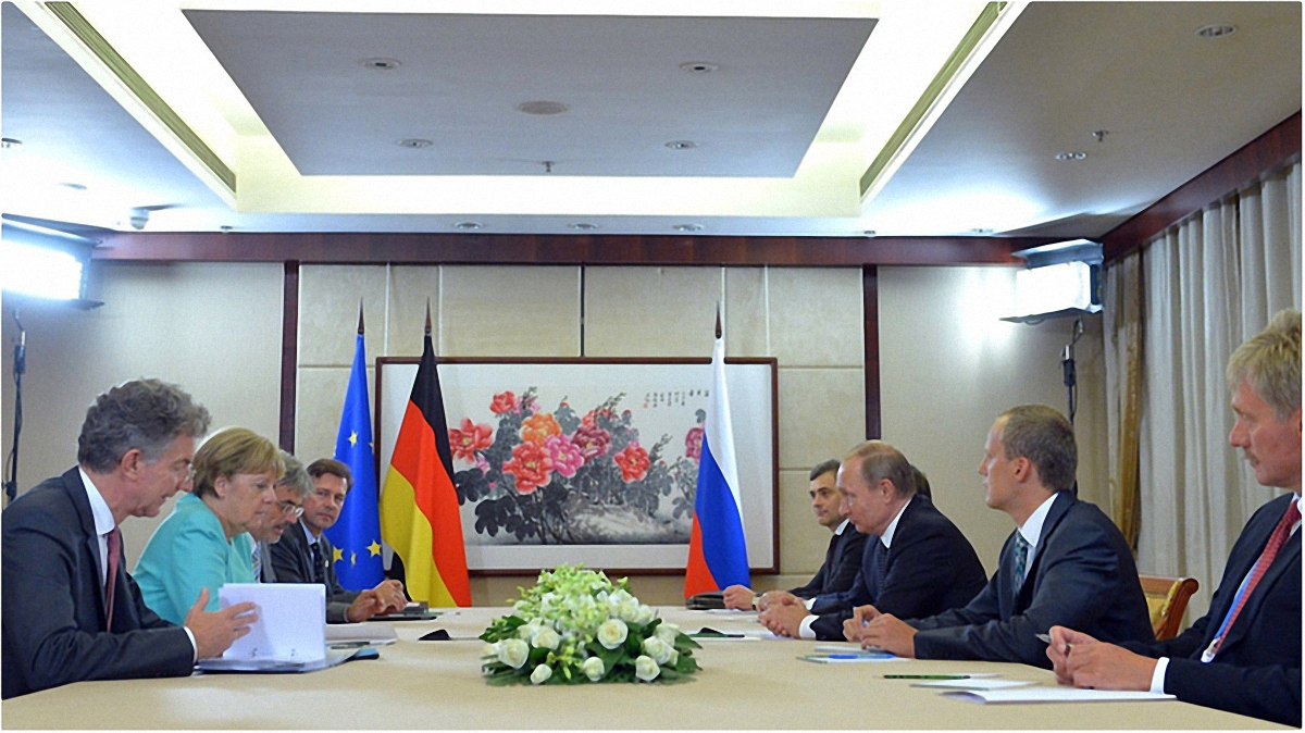 Встреча Меркель и Путина на саммите - фото 1